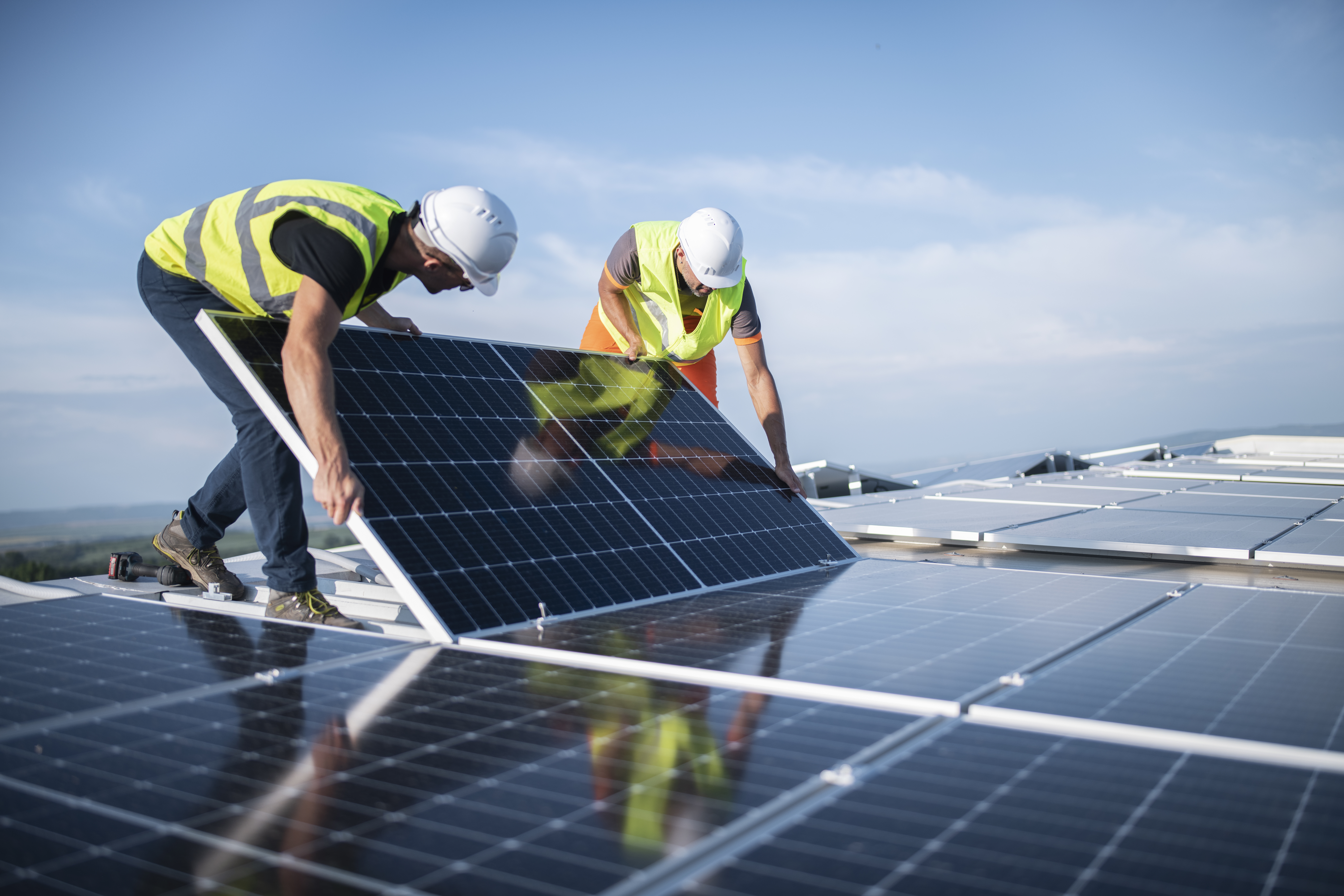Solar panel installation with workers